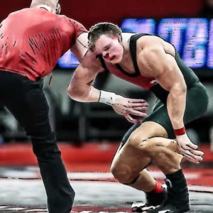 Artistic representation for Husker Wrestling Roundup : Burroughs Back in Town , Green in WTT , Araujo at Worlds , New Staff Addition , and More ...